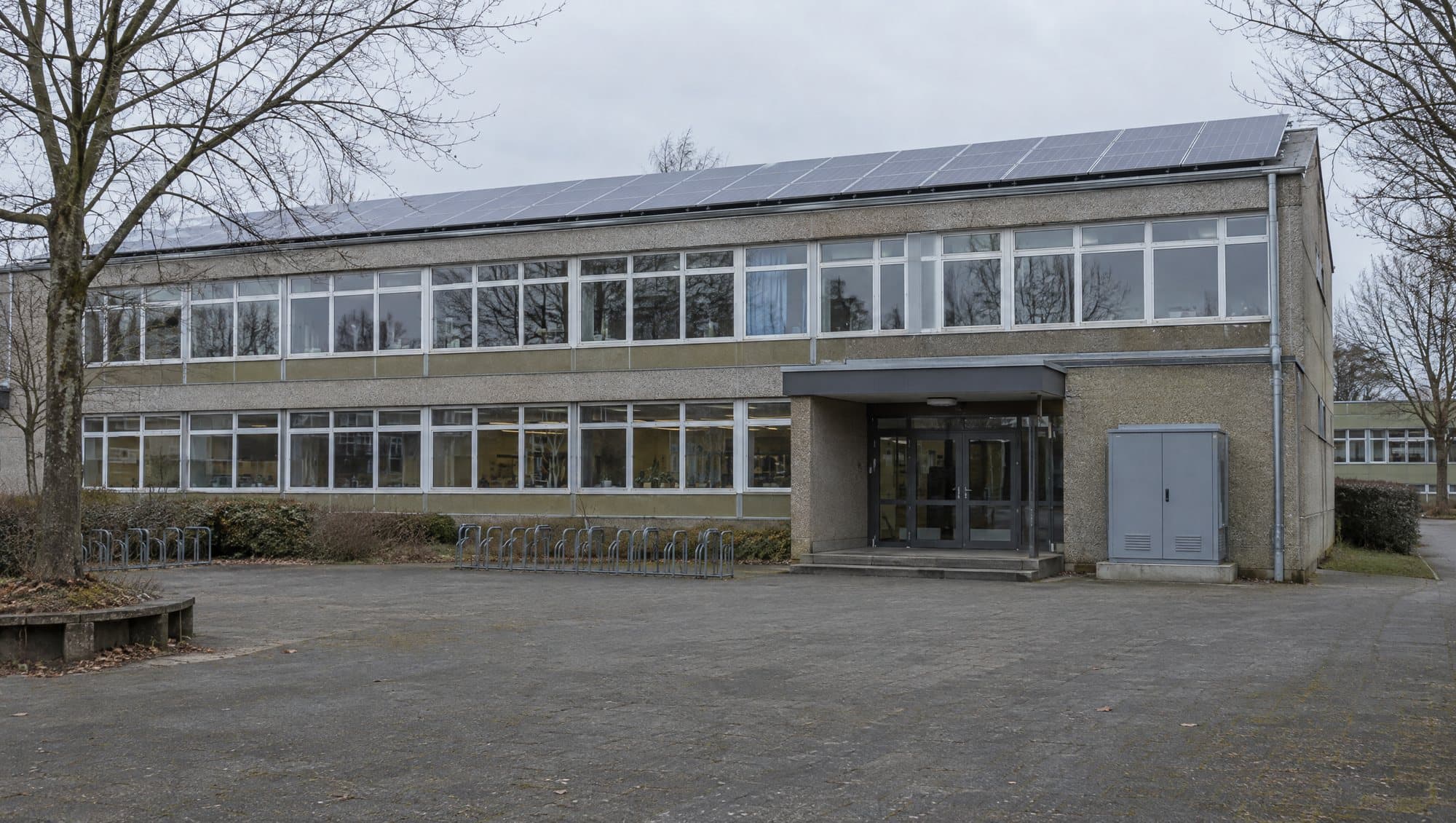 School building with rooftop solar PV and a storage cabinet
